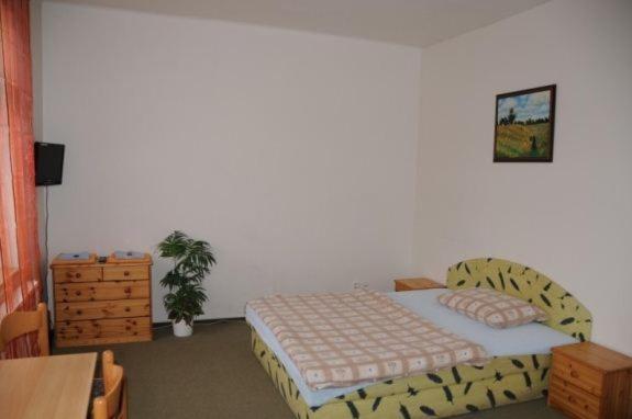 Postel nebo postele na pokoji v ubytování Penzion Pupendo