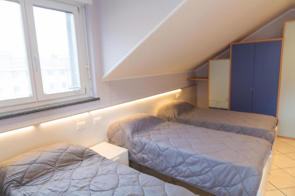 Postel nebo postele na pokoji v ubytování Residenza CONCORDIA