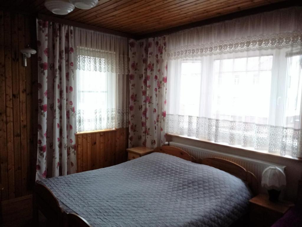 Posteľ alebo postele v izbe v ubytovaní Pokoje PETRA pod Bocianem