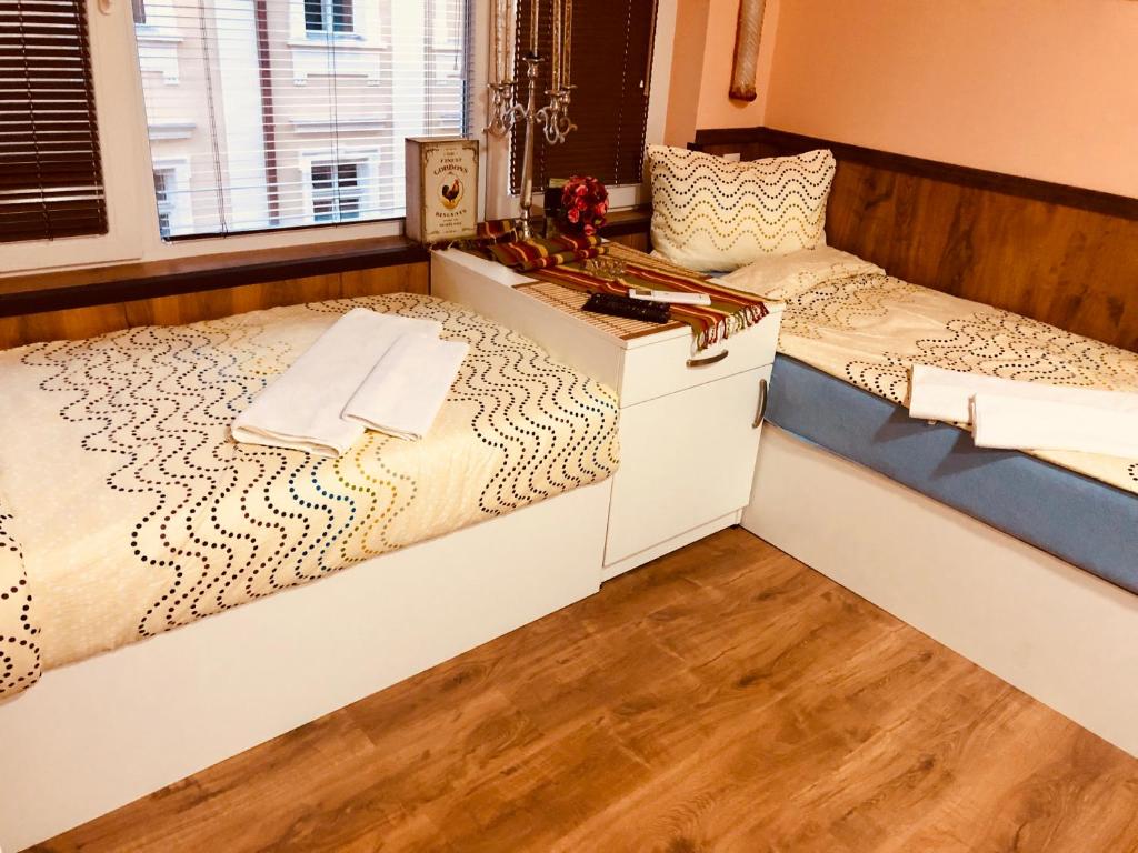 A bed or beds in a room at Sofia centre