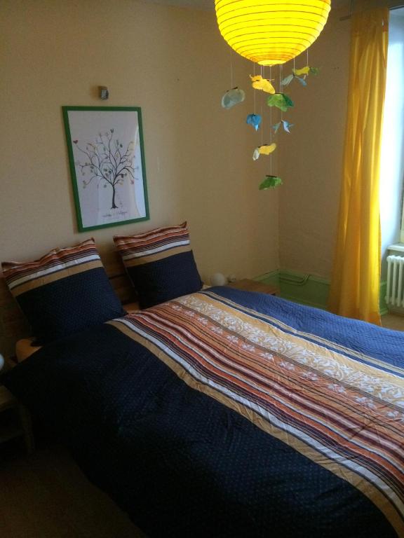 Postel nebo postele na pokoji v ubytování Chambres d'hôtes Chez Epicure