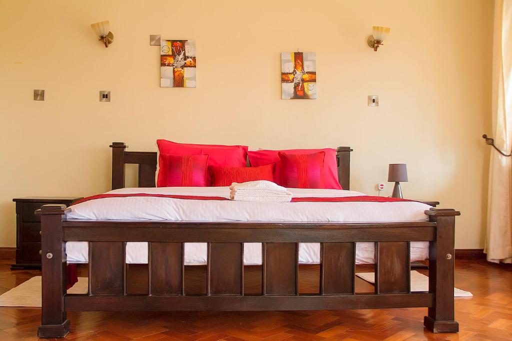 Postel nebo postele na pokoji v ubytování Orchid Homes, Gigiri