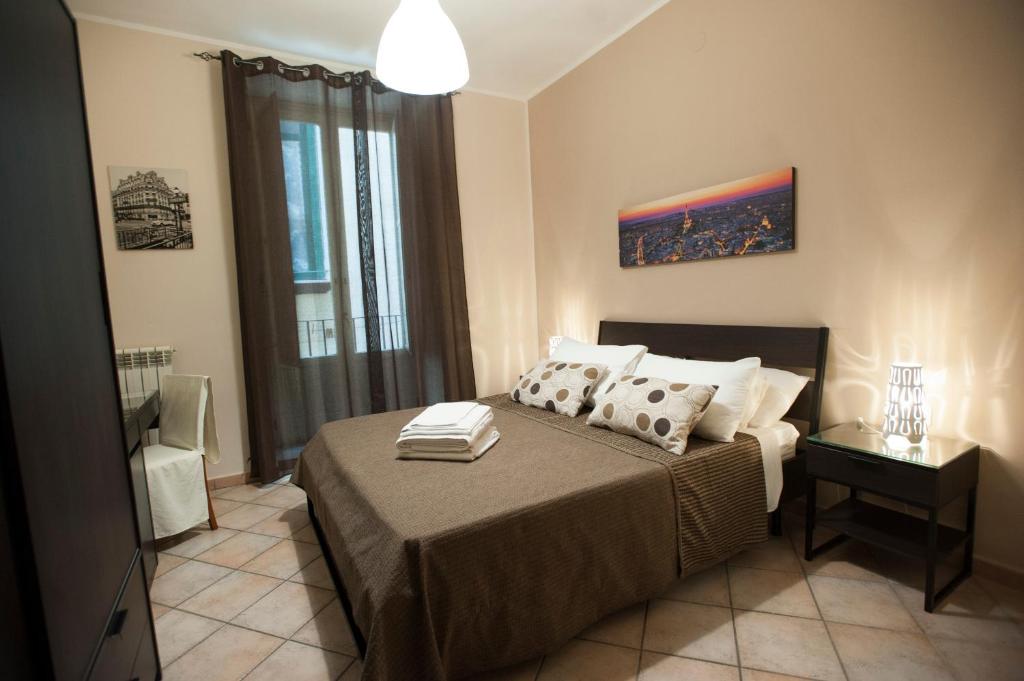 a bedroom with a bed with two pillows on it at Bedroom 21 in Salerno