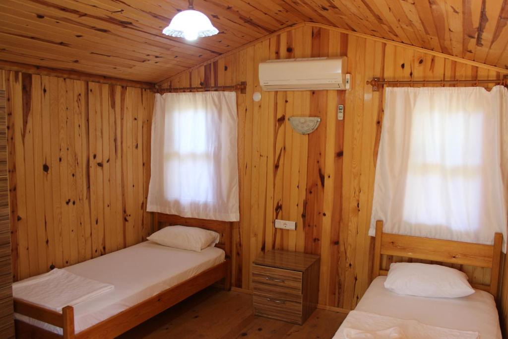 Postel nebo postele na pokoji v ubytování Duran Bungalow