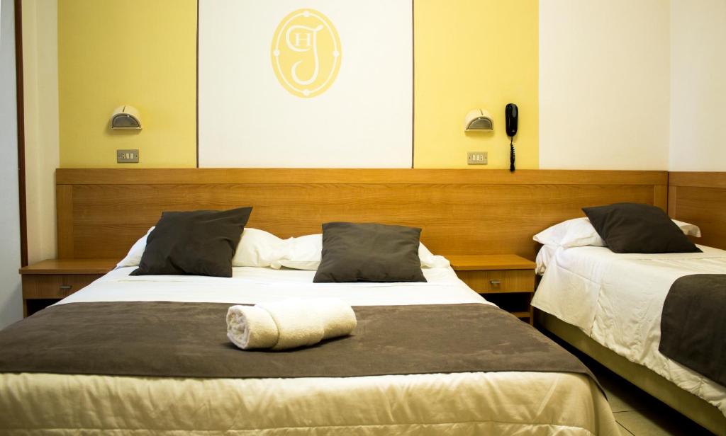 Postel nebo postele na pokoji v ubytování Hotel Jolie