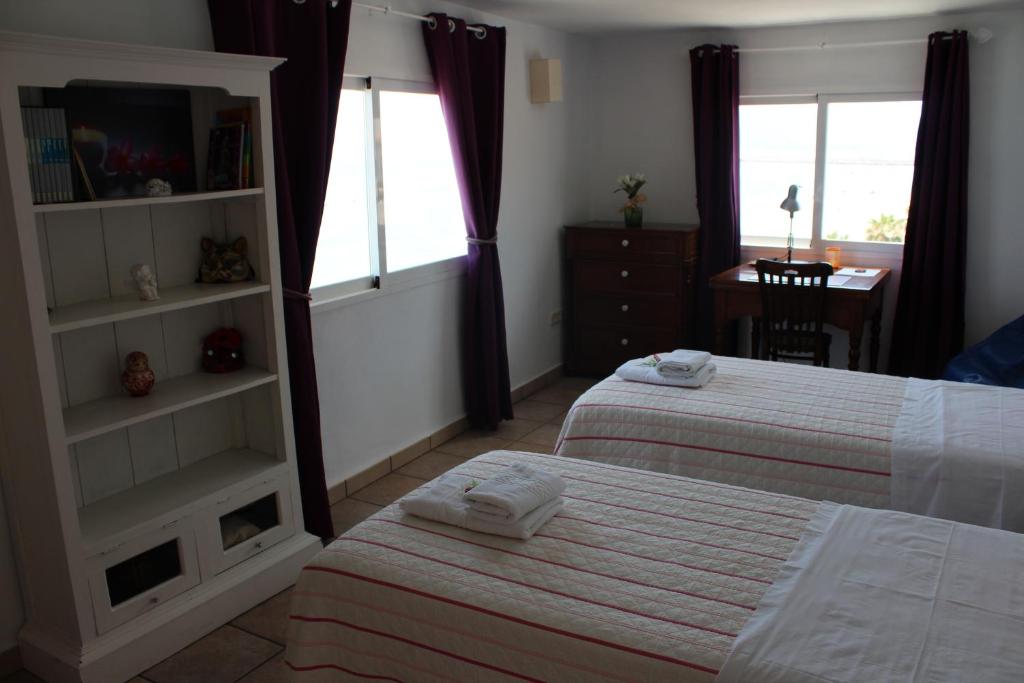 A bed or beds in a room at Los Azules de Altea