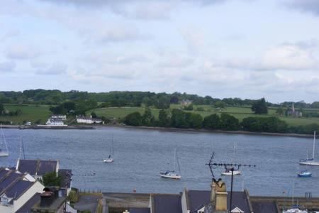 a large body of water with boats in it at Spacious Victorian Flat 3 bed, Ideal Base for Snowdonia in Bangor