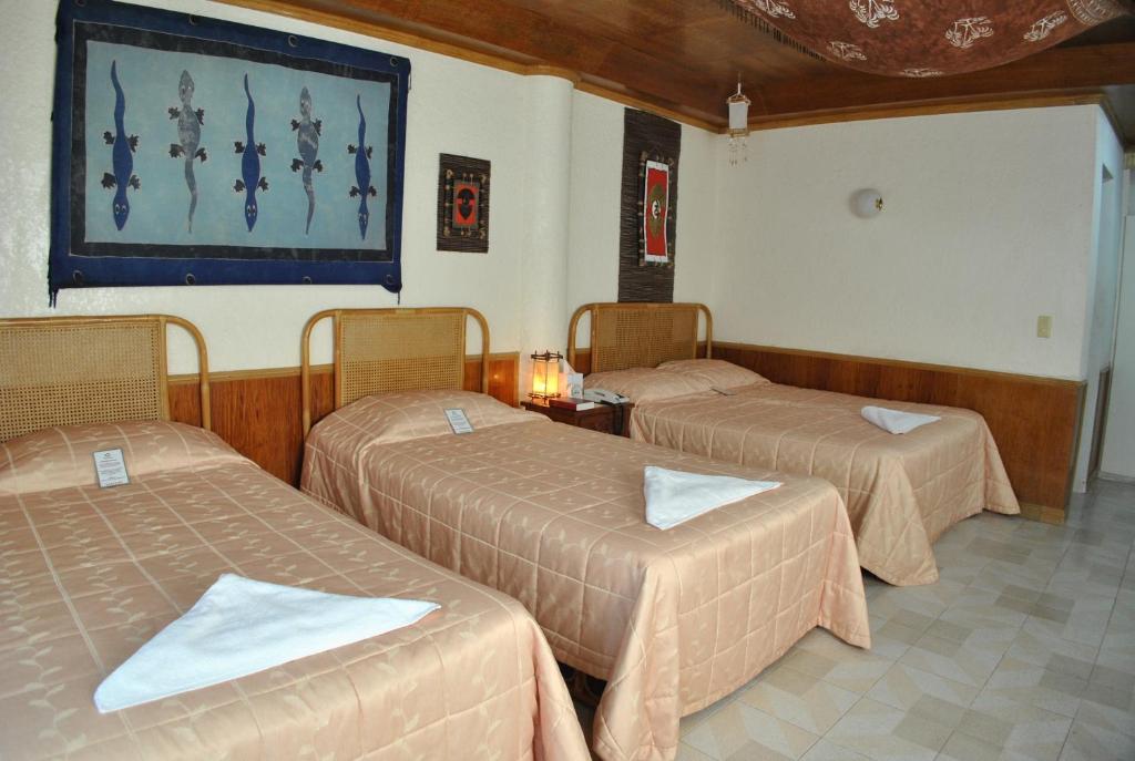 Postel nebo postele na pokoji v ubytování Surfside Boracay Resort