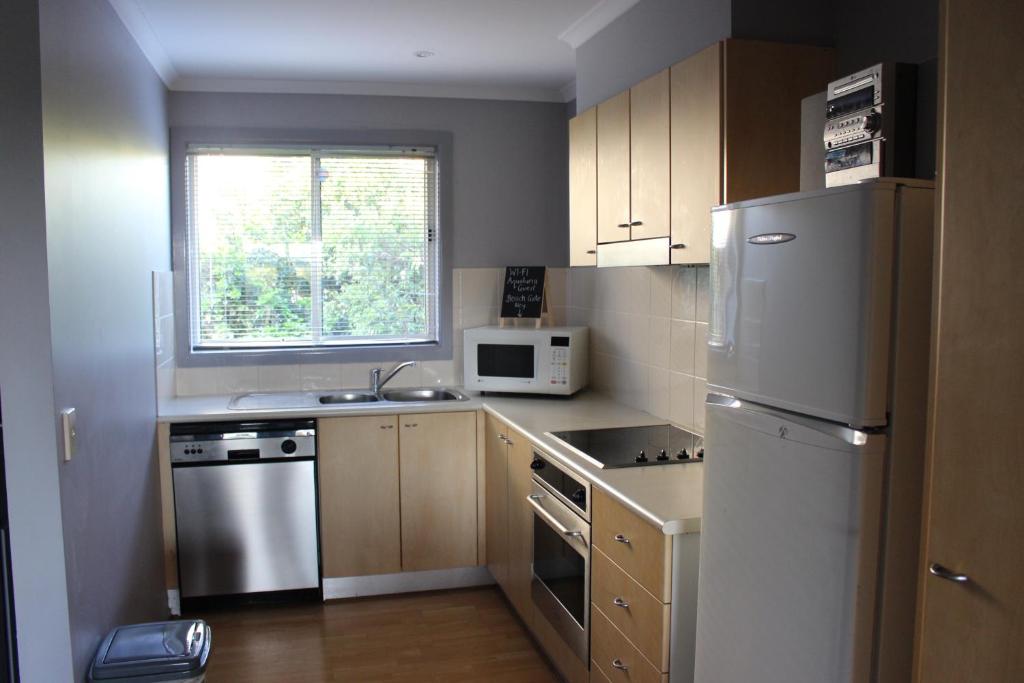 Kuchyň nebo kuchyňský kout v ubytování Aqualuna Apartments