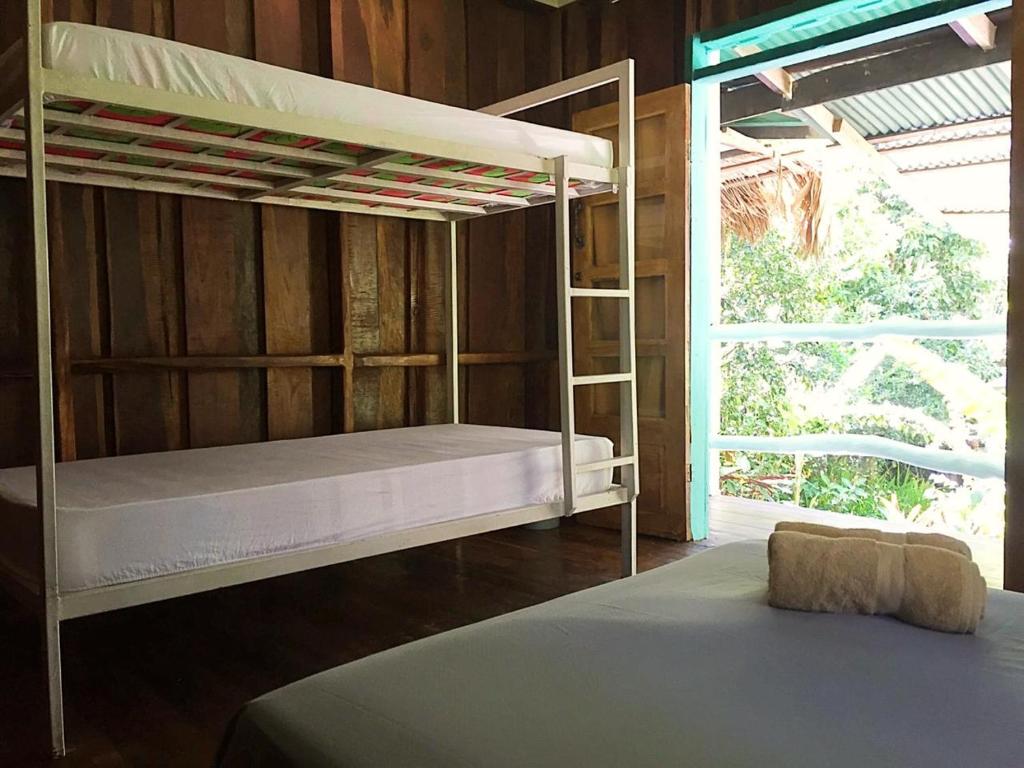 Postel nebo postele na pokoji v ubytování Madre Selva Hostel