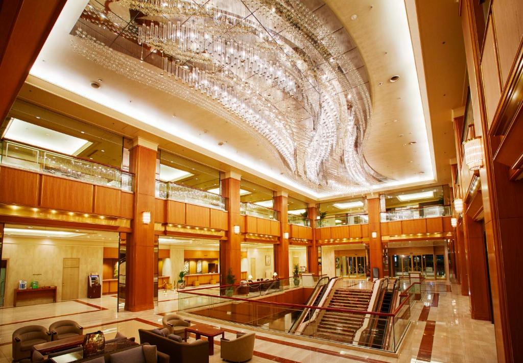 a large building with a large chandelier on the ceiling at Royal Park Hotel in Tokyo