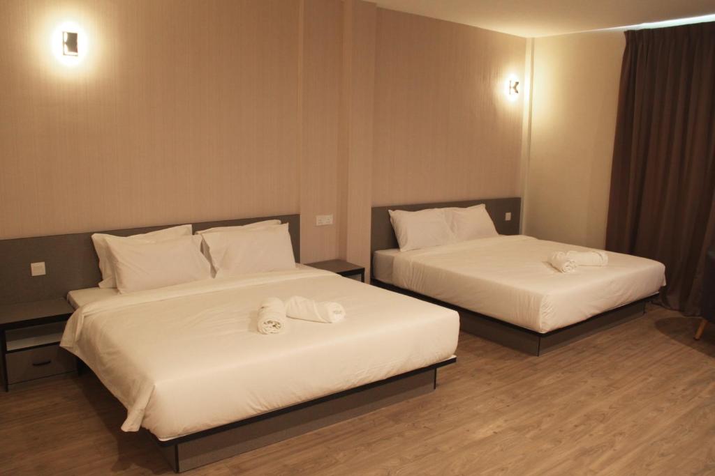 Postel nebo postele na pokoji v ubytování Gergasi Inn