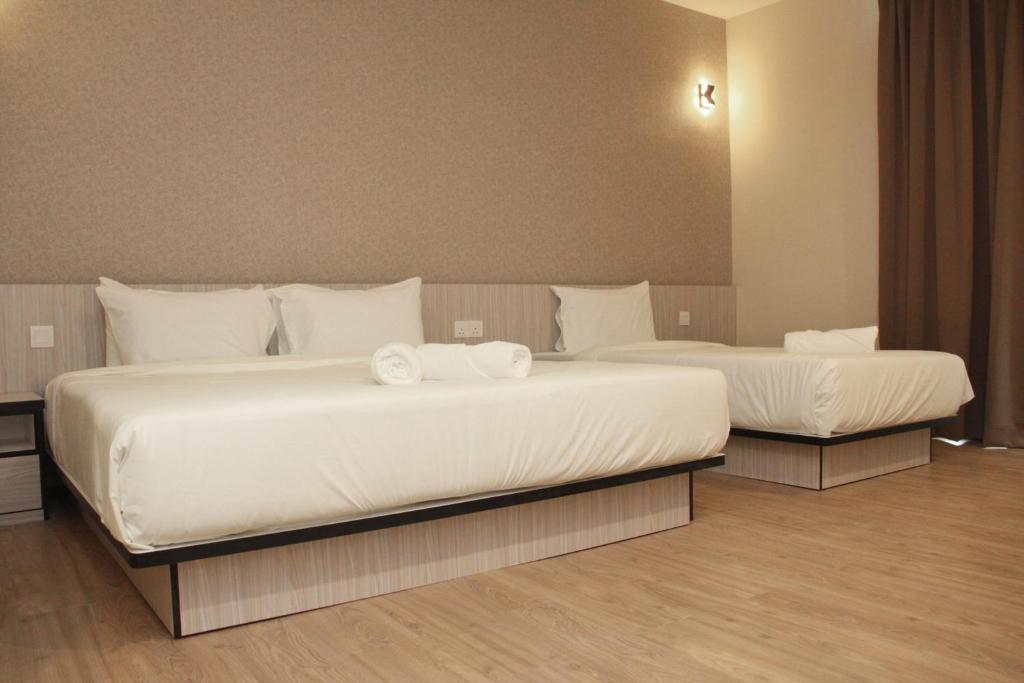Postel nebo postele na pokoji v ubytování Gergasi Inn