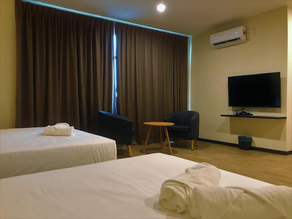 Postel nebo postele na pokoji v ubytování Gergasi Inn