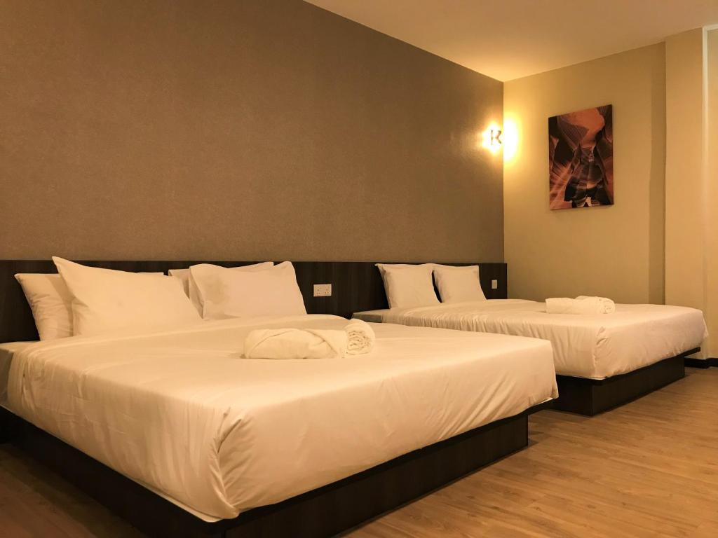 Postel nebo postele na pokoji v ubytování Gergasi Inn