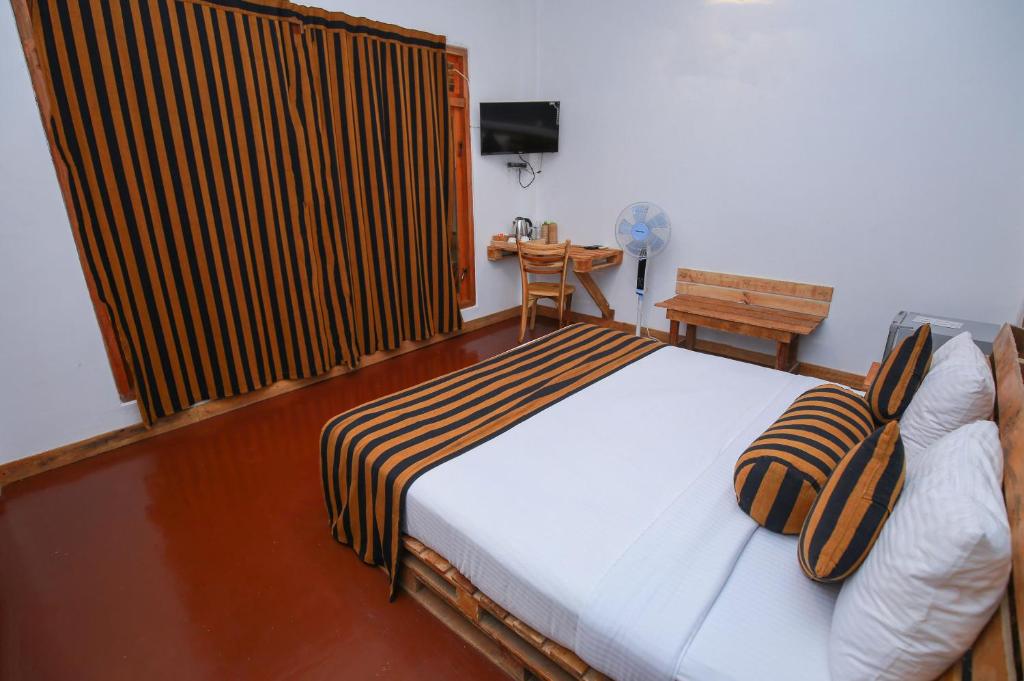 Postel nebo postele na pokoji v ubytování The Spice Lodge