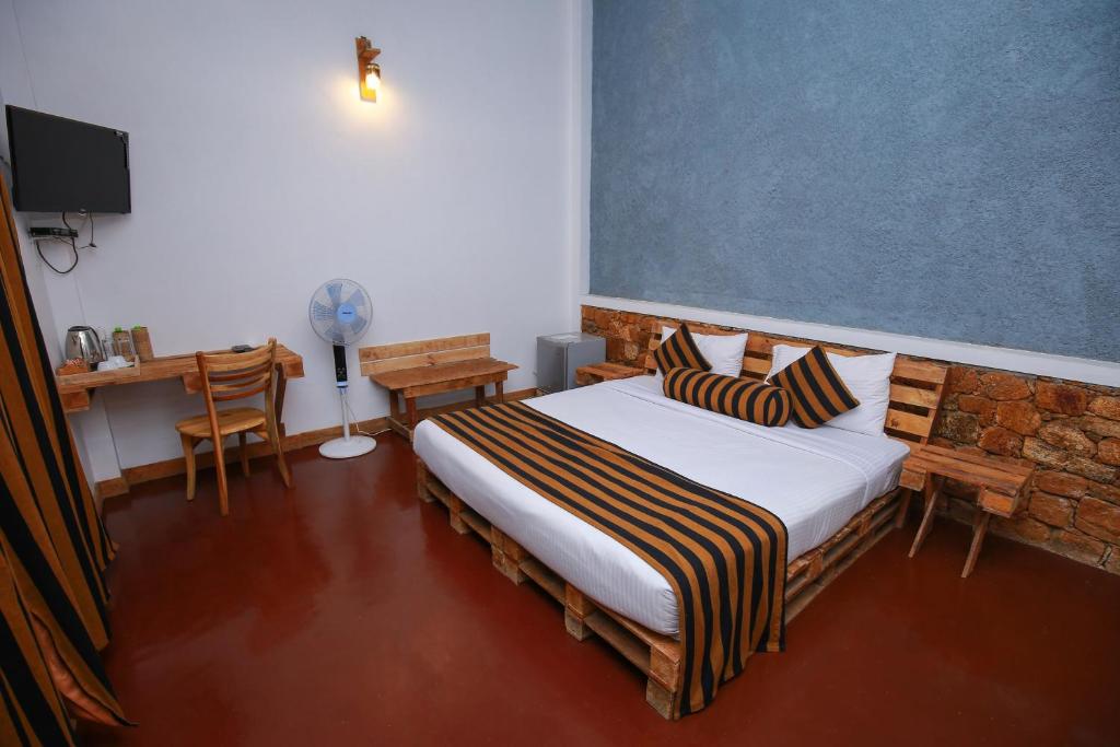 Postel nebo postele na pokoji v ubytování The Spice Lodge