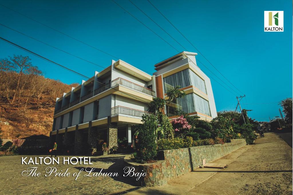 a building on the side of a street at Kalton Hotel in Labuan Bajo