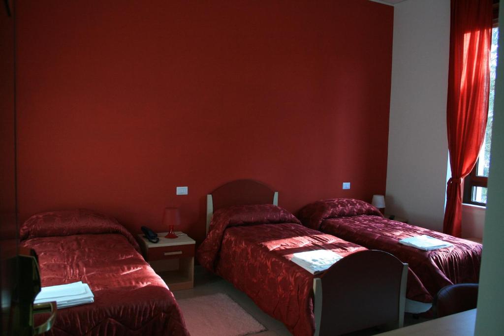 Postel nebo postele na pokoji v ubytování Albergo Ma.Re