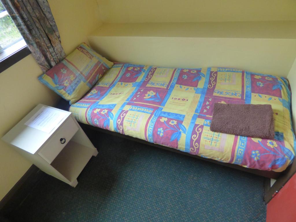 Voodi või voodid majutusasutuse Chateau Backpackers & Motels toas