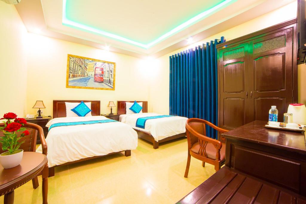 Postel nebo postele na pokoji v ubytování Hào Anh Villa Hội An