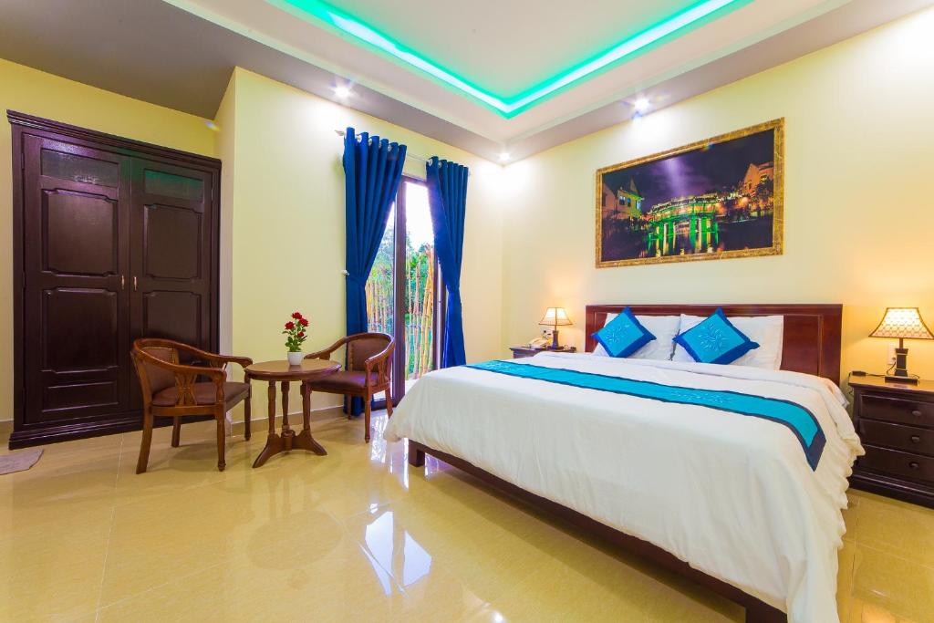 Postel nebo postele na pokoji v ubytování Hào Anh Villa Hội An