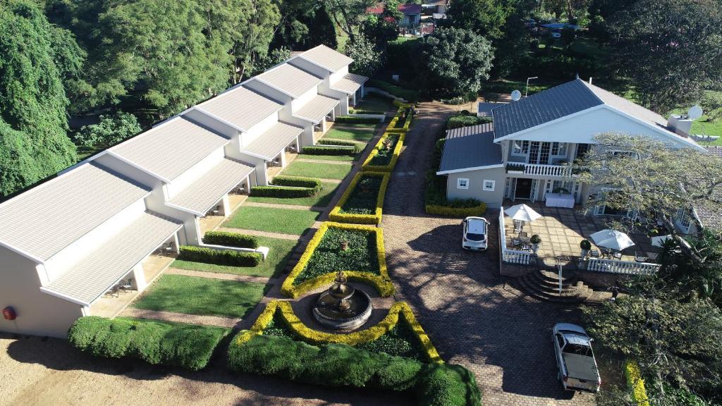 an aerial view of a house with white roofs at Valley Lodge in Hillcrest