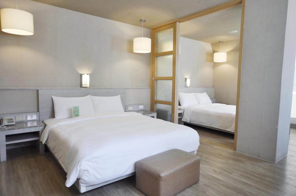 Postelja oz. postelje v sobi nastanitve Kindness Hotel - Hanshen