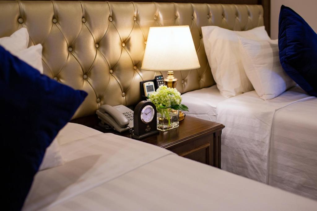 Postel nebo postele na pokoji v ubytování Alisa Hotel & Spa