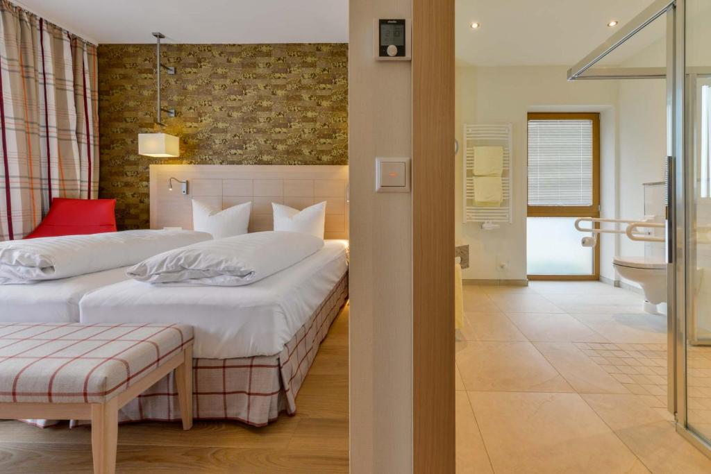 Postel nebo postele na pokoji v ubytování Hotel Pöker