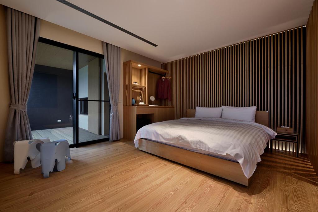Postel nebo postele na pokoji v ubytování Shan Yi Fang Resort