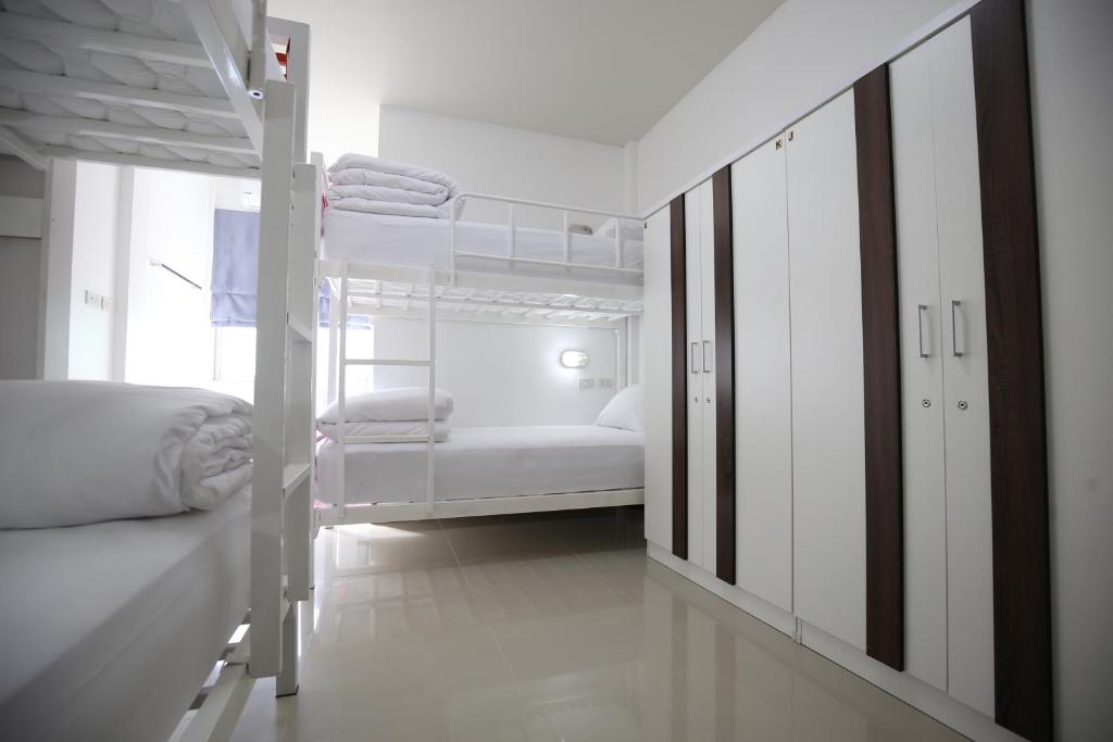 Postel nebo postele na pokoji v ubytování SABUN-NGA HOSTEL
