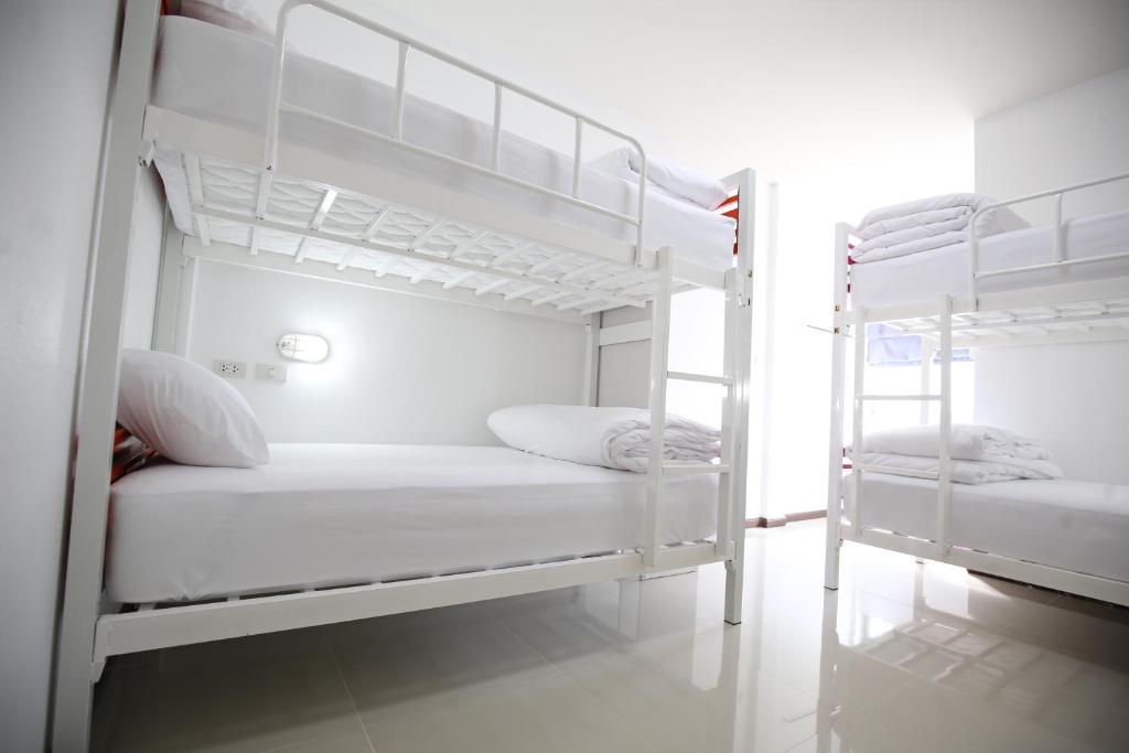 Postel nebo postele na pokoji v ubytování SABUN-NGA HOSTEL