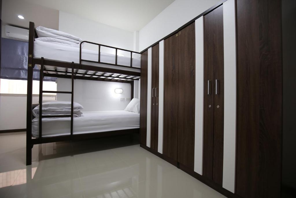 Postel nebo postele na pokoji v ubytování SABUN-NGA HOSTEL
