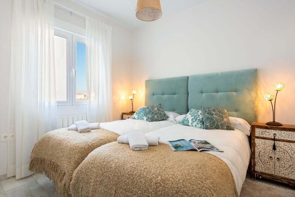 Posteľ alebo postele v izbe v ubytovaní Genteel Home Recogidas