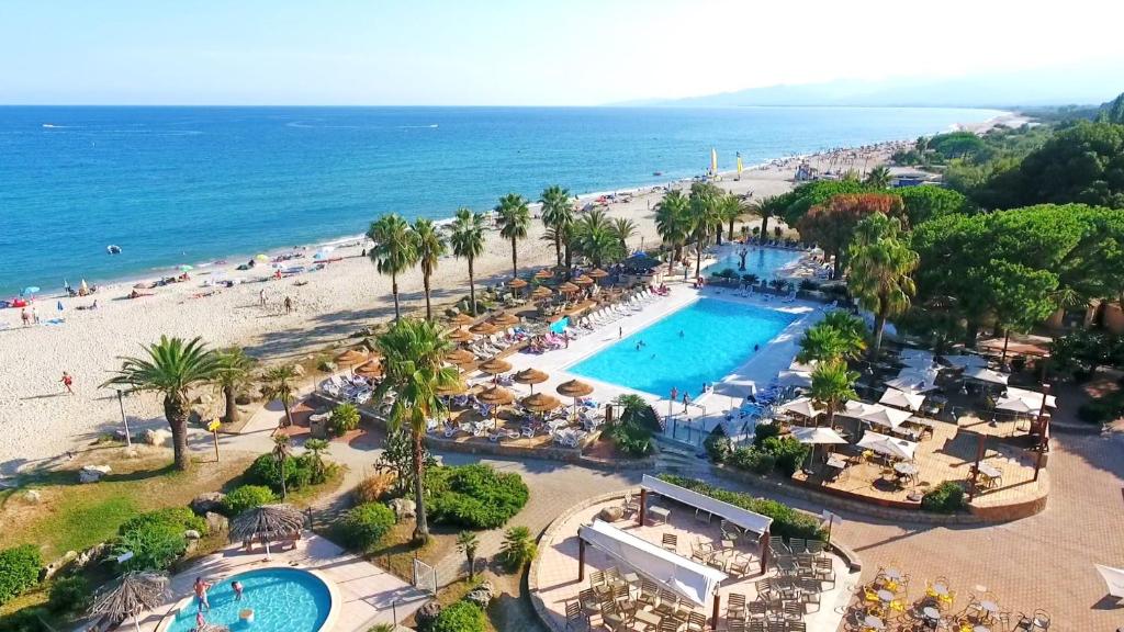 an aerial view of a resort with a beach at Village de Vacances Marina d'Oru in Ghisonaccia