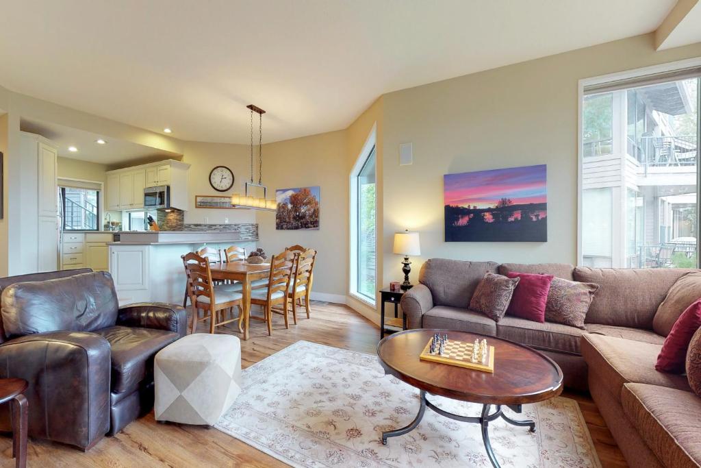a living room with a couch and a table at Ponderosa Views in Bend