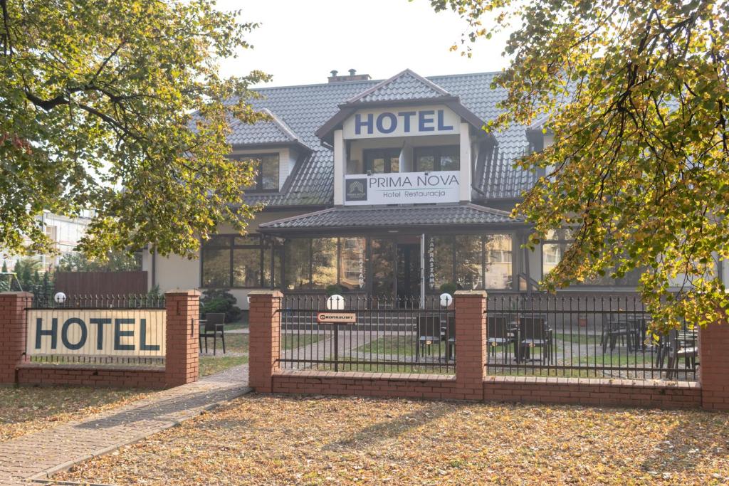 a hotel with a fence in front of it at Prima in Puławy