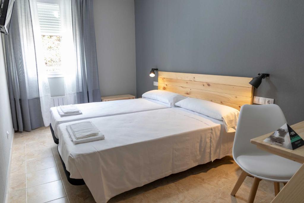 Cama o camas de una habitación en Alda Estella Hostel