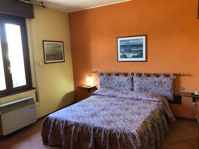 Postel nebo postele na pokoji v ubytování Hotel Il Granaio