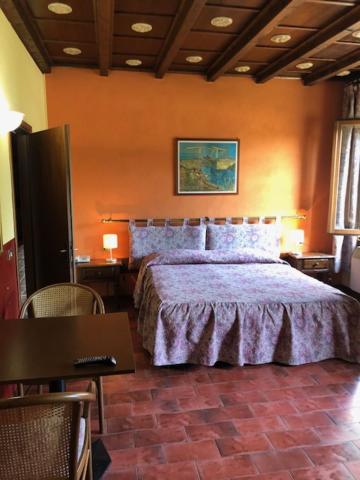 Postel nebo postele na pokoji v ubytování Hotel Il Granaio