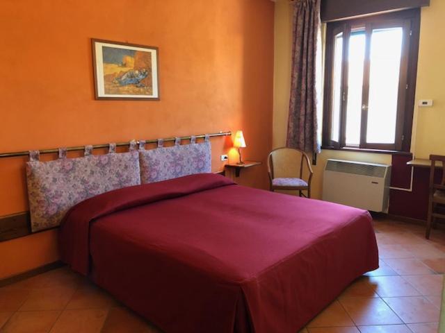 Postel nebo postele na pokoji v ubytování Hotel Il Granaio