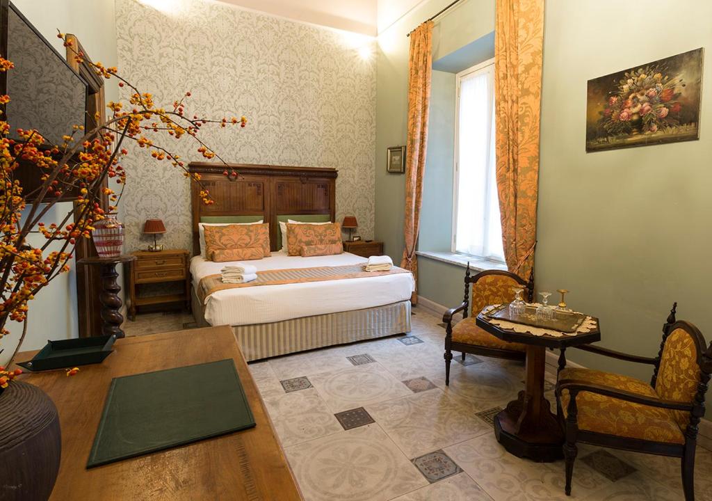 Posteľ alebo postele v izbe v ubytovaní Navona Grand Suite