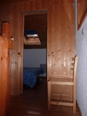 a room with a wooden wall and a room with a bench at Mont Blanc Soleil E17 in Manigod