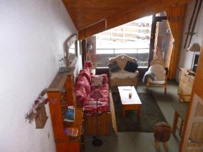 a living room with a couch and a table at LES FEUDIERES in Manigod