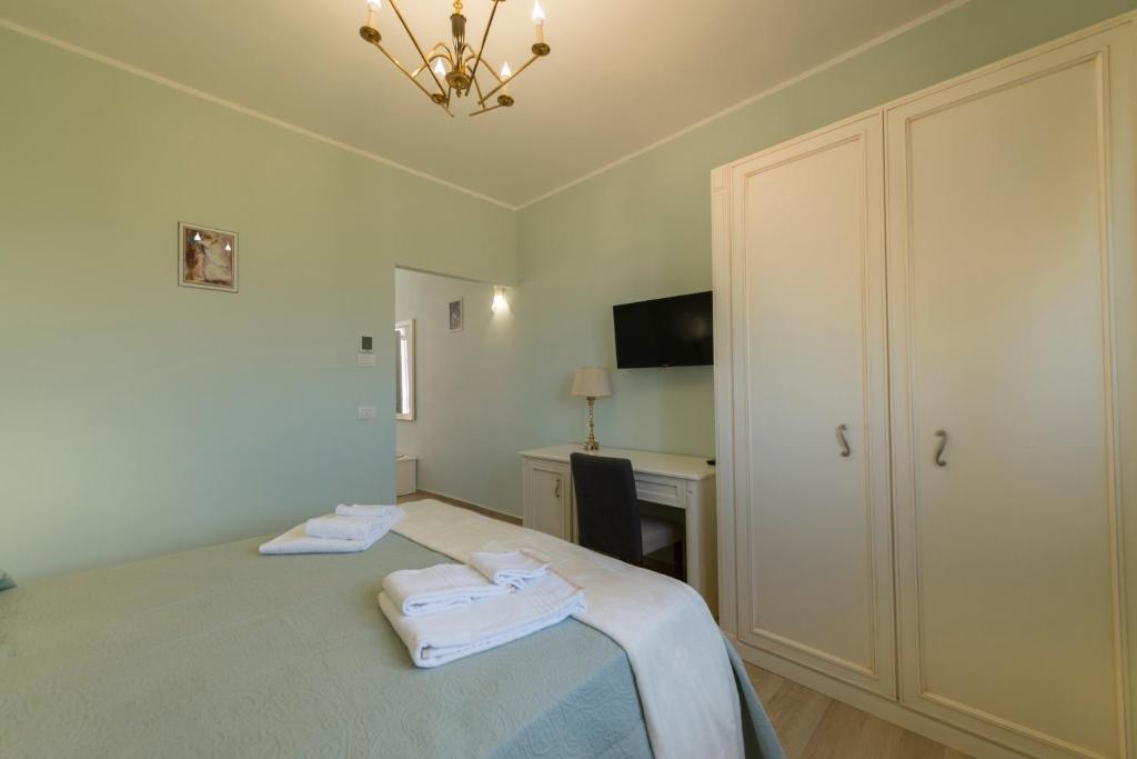 Postel nebo postele na pokoji v ubytování Podere Abbazia b&b
