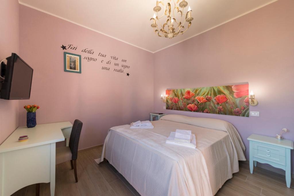 Postel nebo postele na pokoji v ubytování Podere Abbazia b&b