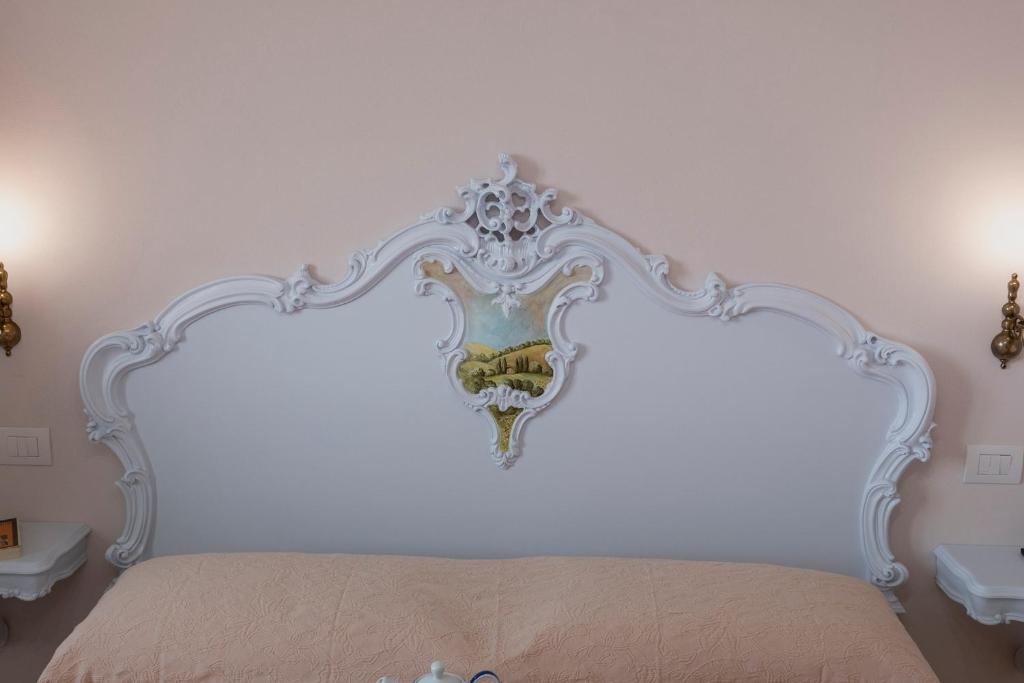 Postel nebo postele na pokoji v ubytování Podere Abbazia b&b