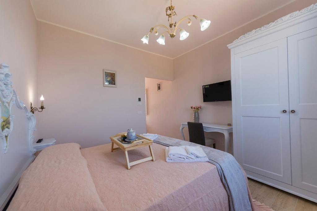 Postel nebo postele na pokoji v ubytování Podere Abbazia b&b