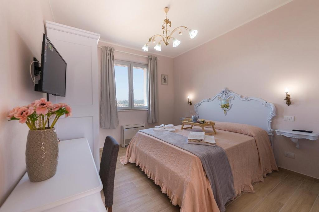 Postel nebo postele na pokoji v ubytování Podere Abbazia b&b